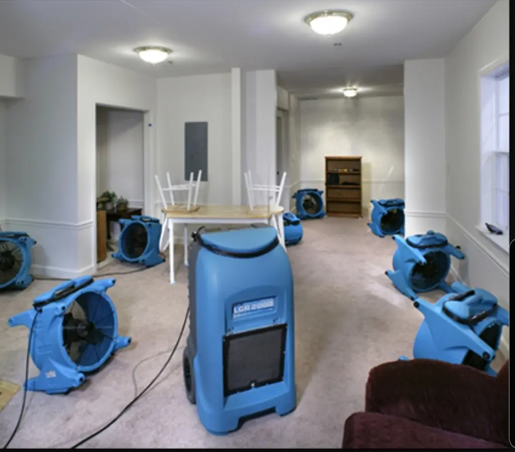Air movers and dehumidifier setup for Water Damage Restoration in De Pere
